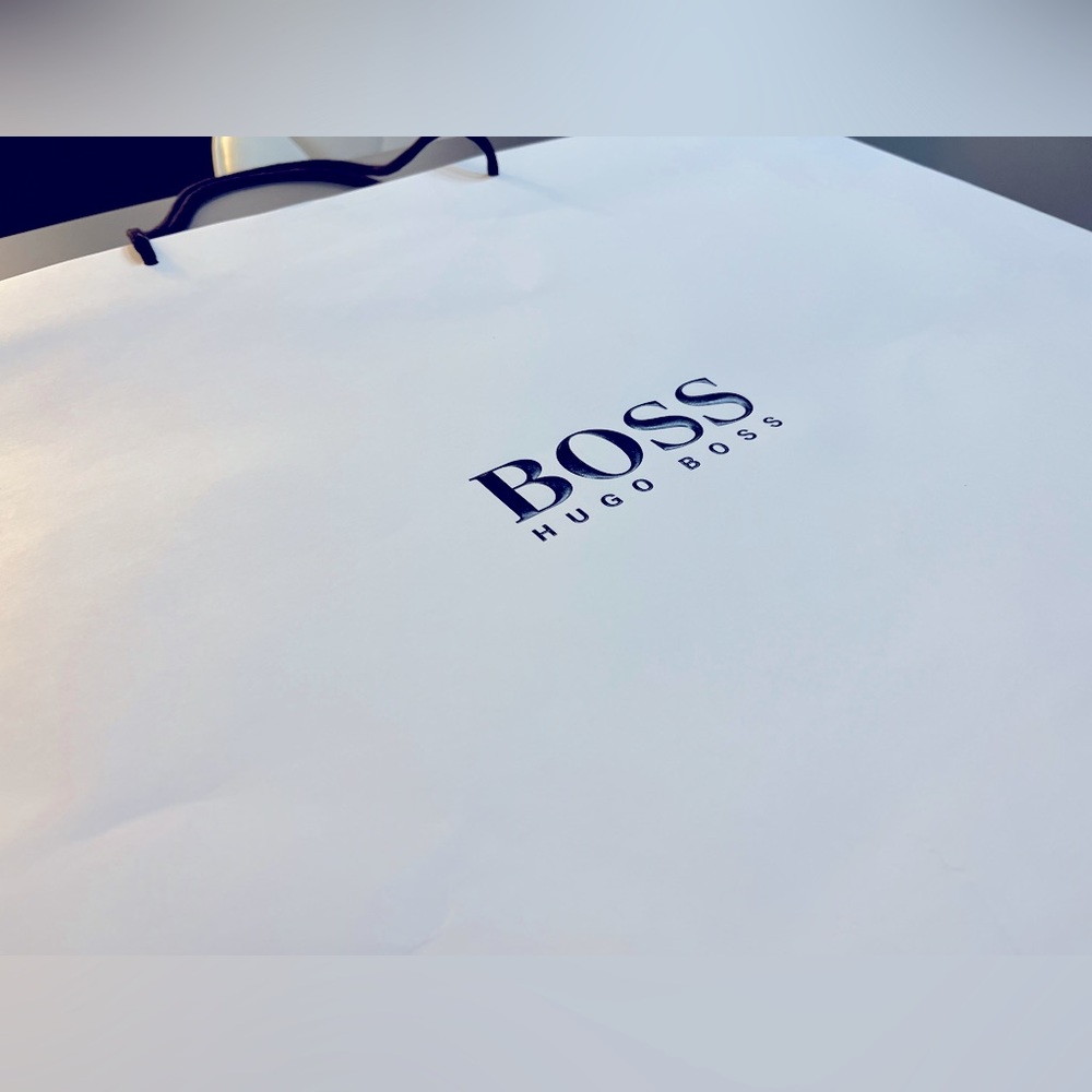 An extra large BOSS bag with embossed brand logo.